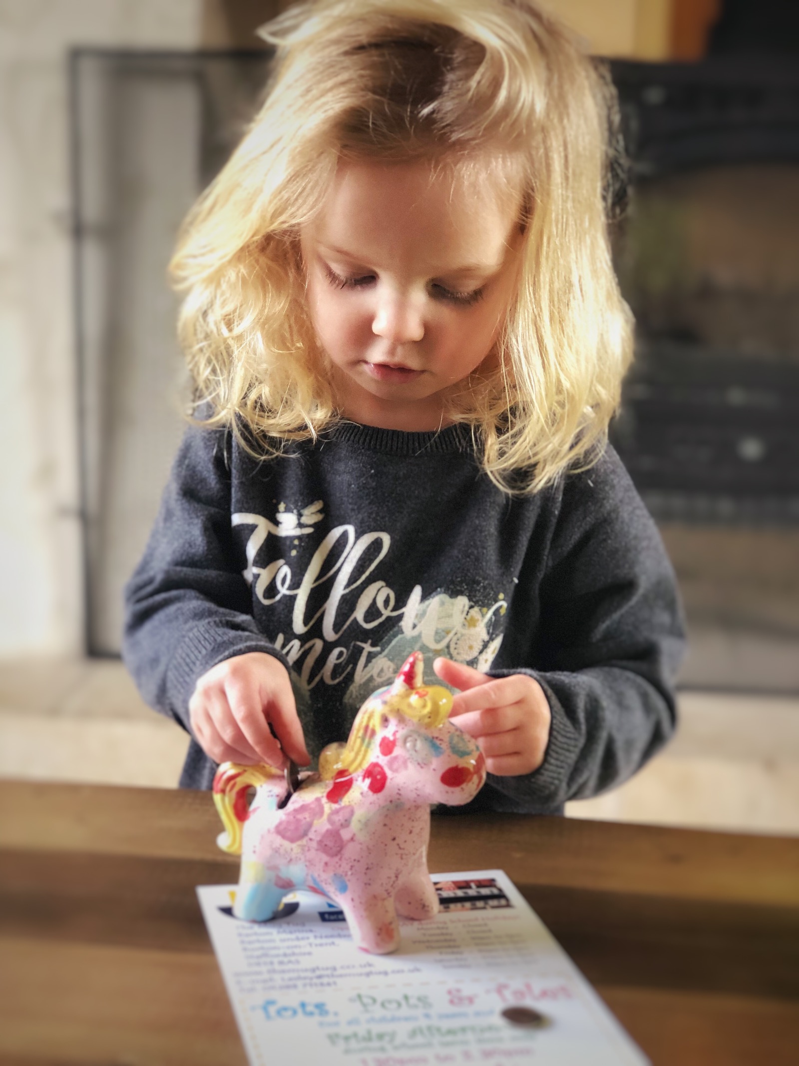Blonde haired Little girl with painted unicorn